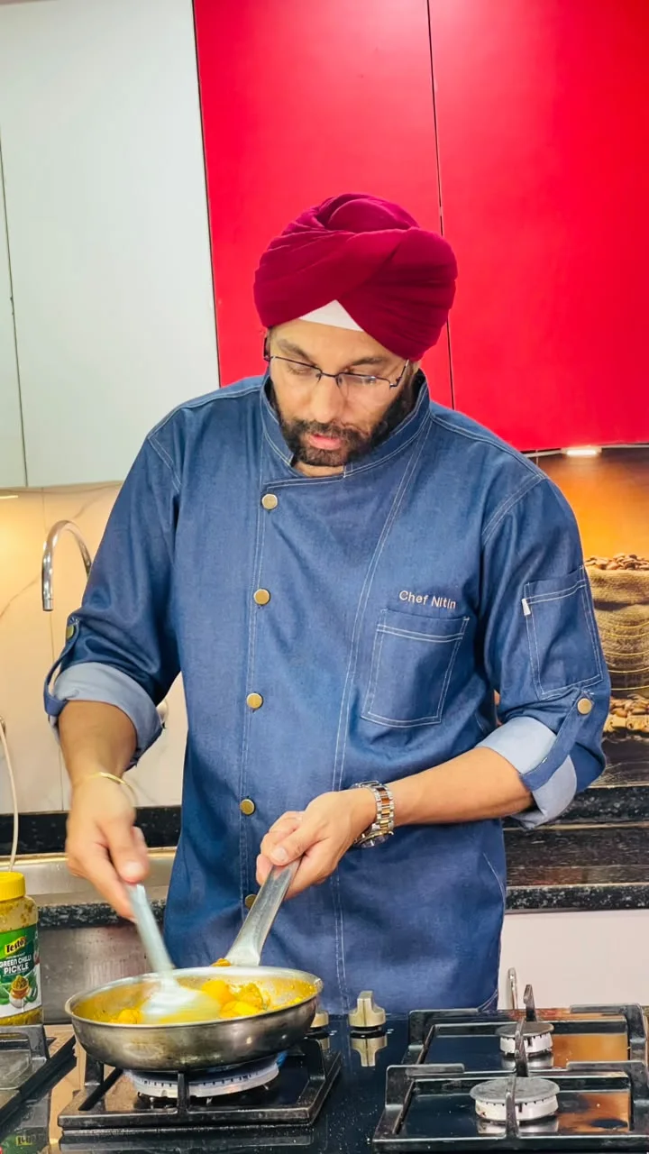 Chef Nitin at the stove